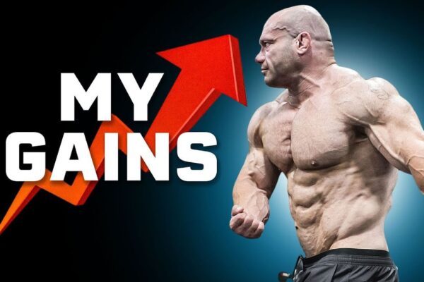Thumbnail for "5 Things I Just Learned That Skyrocketed My Gains" from Renaissance Periodization: A muscular man in a gym setting, lifting a barbell with intense focus, surrounded by motivational graphics and bold text highlighting key fitness tips.