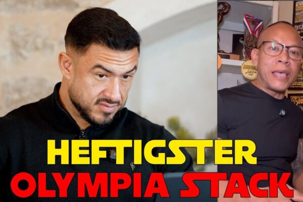 Vorschaubild des Videos "GELEAKED - Olympia Coach Stack" vom Kanal Iron Mike Bodybuilding: Ein muskulöser Bodybuilder posiert im Fitnessstudio, umgeben von Hanteln und Fitnessgeräten.